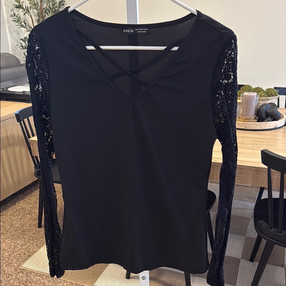 Black semi Fitted Embellished Blouse with lace style sleeves new without tags